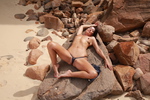 Roxeanne More getting naked on the beach