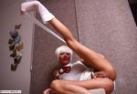 EvaDiangelo White on chair